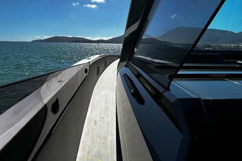  Yacht Photos Pics Futuristic Tecnomar 63 yacht cruising on open sea, 2026 model.