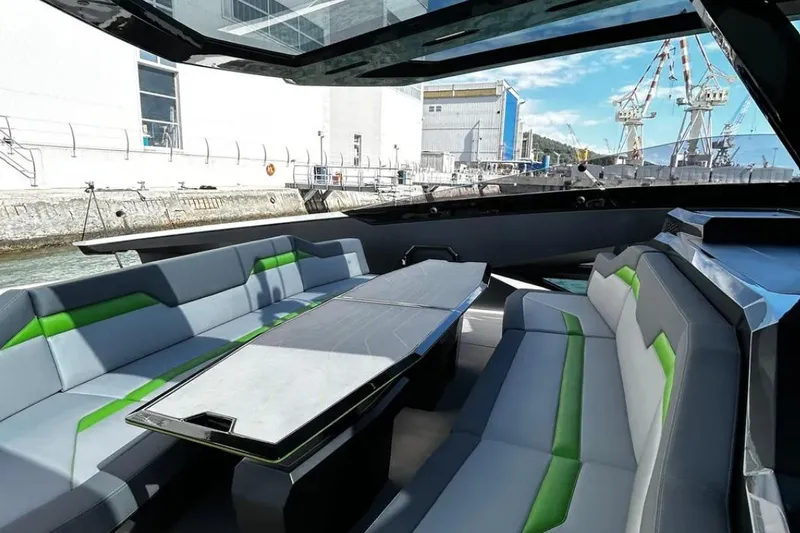  Yacht Photos Pics Luxurious interior of 2026 Tecnomar 63 yacht with modern seating and sleek design.