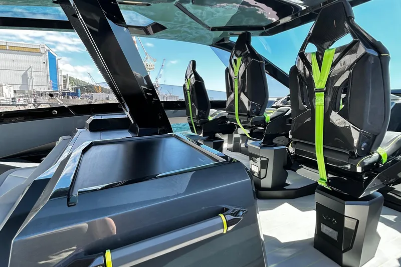  Yacht Photos Pics Luxurious interior of 2026 Tecnomar 63 yacht with sleek design and modern seating.