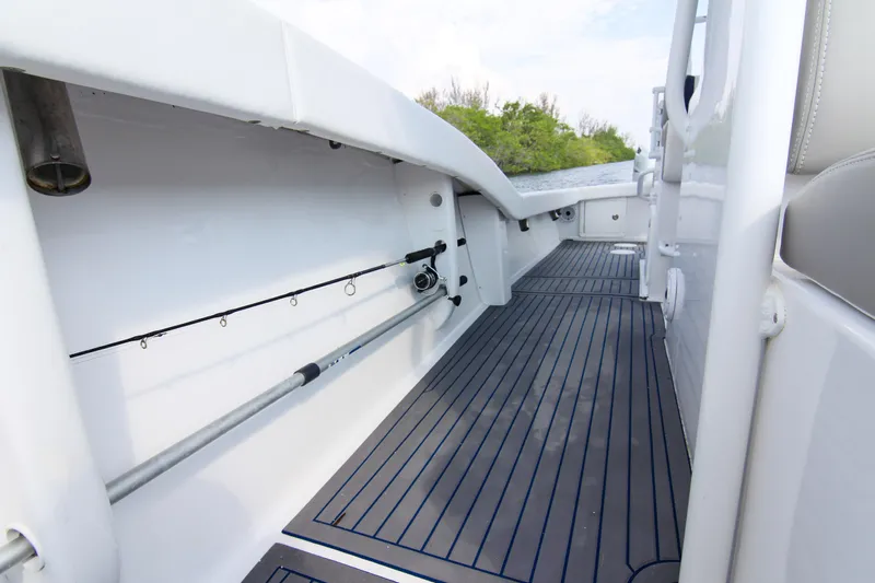  Yacht Photos Pics 1996 Ocean Master 31 Center Console boat interior with rod holders and sleek flooring.