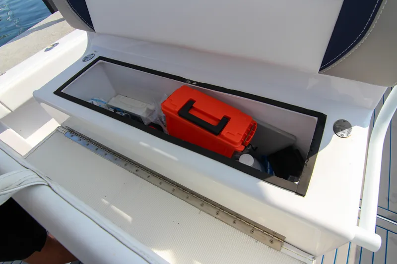  Yacht Photos Pics Storage compartment on a 1996 Ocean Master 31 Center Console boat with orange case.