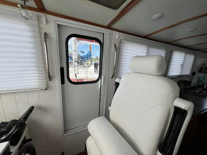 Idaho Red Yacht Photos Pics Interior of 2018 Great Harbour TT35 boat with white seating and door.