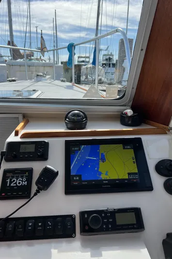 Idaho Red Yacht Photos Pics Great Harbour TT35 2018 boat cockpit with navigation equipment and marina view.