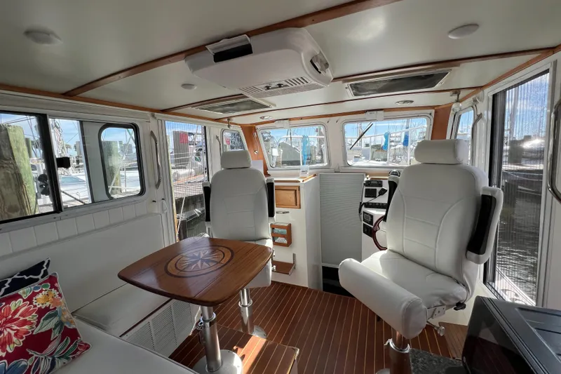 Idaho Red Yacht Photos Pics Interior of 2018 Great Harbour TT35 boat with white seating and wooden accents.