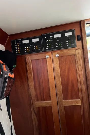 Idaho Red Yacht Photos Pics Control panel and wooden cabinets inside a 2018 Great Harbour TT35 boat.
