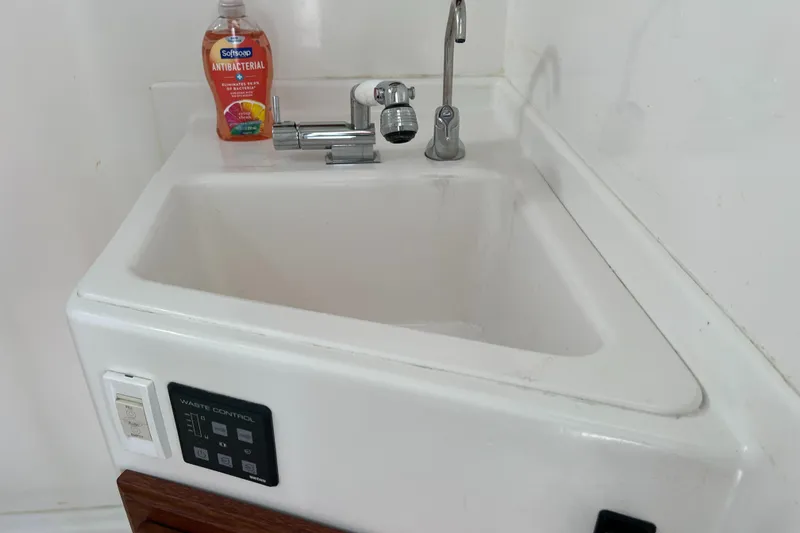 Idaho Red Yacht Photos Pics White sink with faucet and soap bottle in a 2018 Great Harbour TT35 boat.