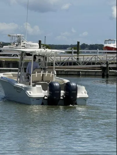  Yacht Photos Pics 2023 Key West 263 FS boat with dual engines docked in a marina.