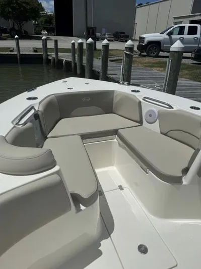  Yacht Photos Pics 2023 Key West 263 FS boat with beige seating at a dock.