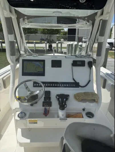  Yacht Photos Pics 2023 Key West 263 FS boat dashboard with steering wheel and navigation system.