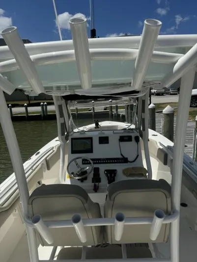  Yacht Photos Pics 2023 Key West 263 FS boat interior with helm, seats, and rod holders.