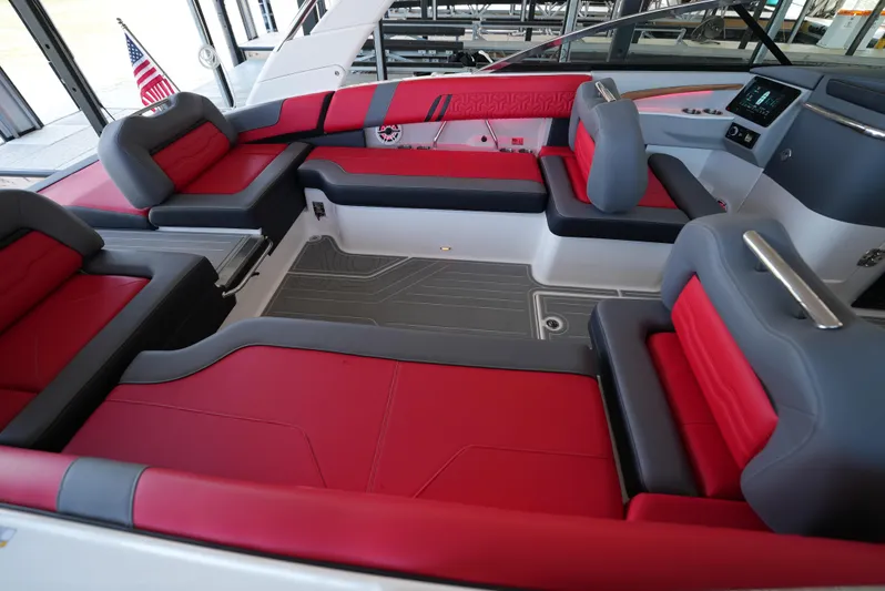  Yacht Photos Pics Luxurious 2025 Regal LS9 boat interior with red and gray seating, modern design.