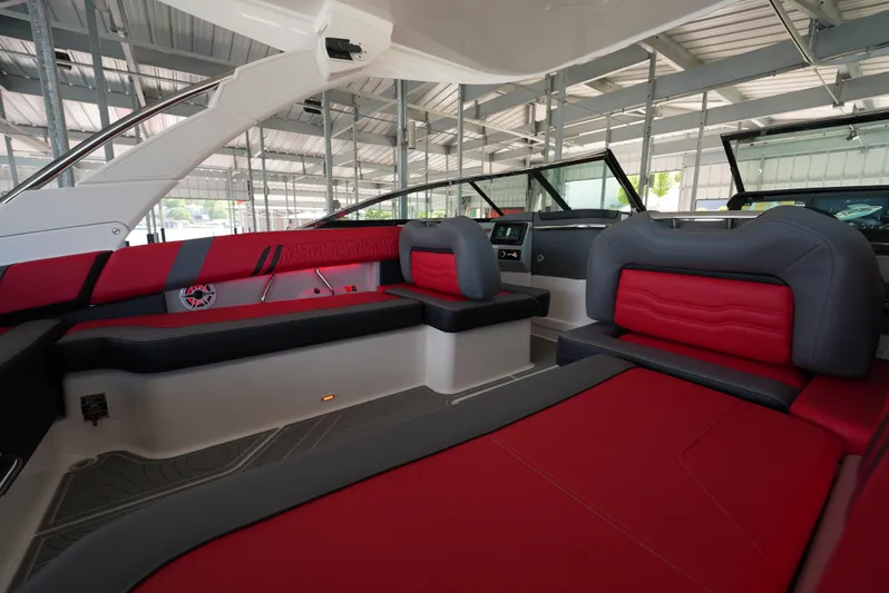  Yacht Photos Pics Luxurious interior of 2025 Regal LS9 boat with red and gray seating.