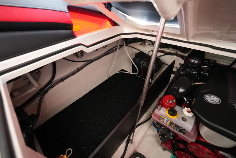  Yacht Photos Pics Engine compartment of 2025 Regal LS9 boat, showcasing mechanical components and storage area.