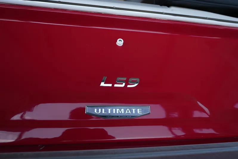  Yacht Photos Pics 2025 Regal LS9 rear badge on red vehicle, featuring "Ultimate" emblem.