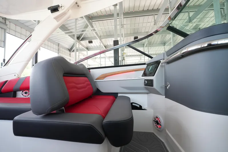  Yacht Photos Pics 2025 Regal LS9 boat interior with red and gray seating, modern dashboard, and sleek design.