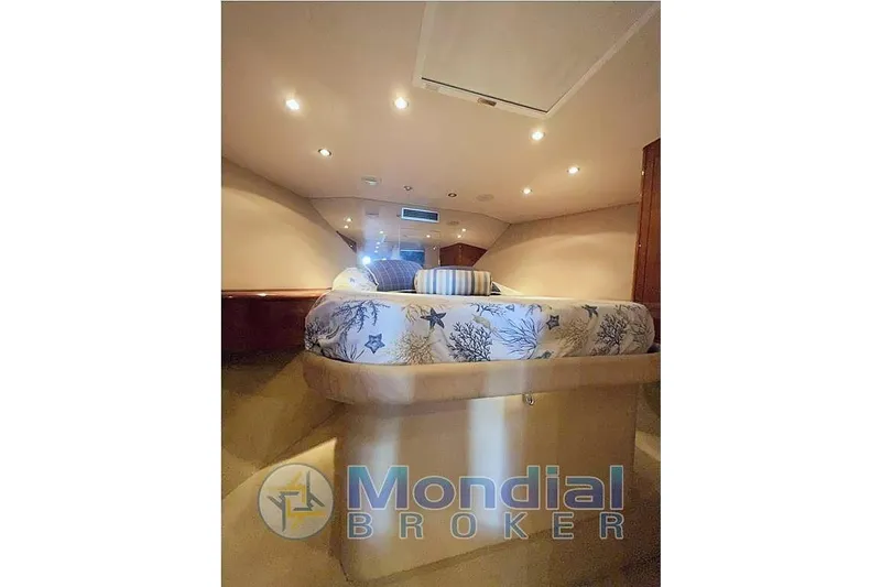  Yacht Photos Pics Luxurious cabin interior of 2006 Hatteras 50 Convertible yacht with elegant bedding.