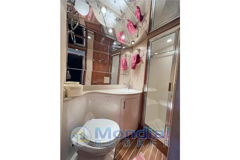  Yacht Photos Pics Luxurious bathroom in 2006 Hatteras 50 Convertible yacht with modern fixtures and elegant design.