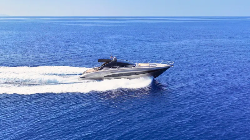 W Yacht Photos Pics Luxury 2009 Riva 63 Vertigo yacht cruising on open blue sea.