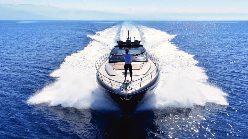 W Yacht Photos Pics Luxury Riva 63 Vertigo yacht cruising on open sea, 2009 model.