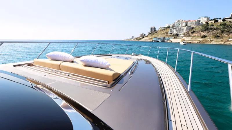 W Yacht Photos Pics Luxurious 2009 Riva 63 Vertigo yacht with sunbathing deck, cruising near scenic coastline.