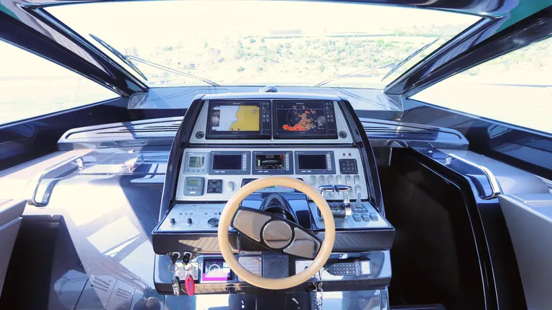 W Yacht Photos Pics Cockpit of 2009 Riva 63 Vertigo yacht with advanced navigation controls and steering wheel.