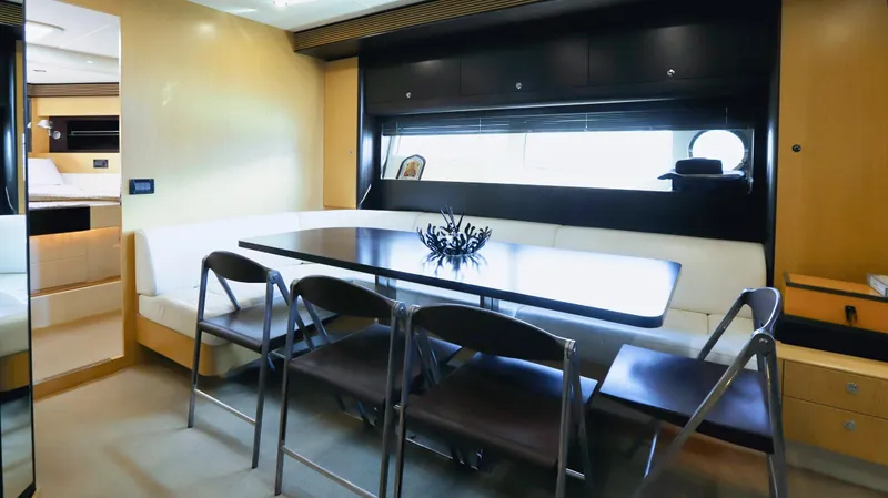 W Yacht Photos Pics Interior of 2009 Riva 63 Vertigo yacht with dining area and modern furnishings.