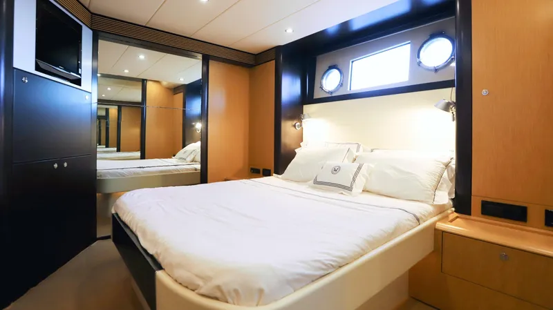 W Yacht Photos Pics Luxurious bedroom interior of 2009 Riva 63 Vertigo yacht with modern design and cozy ambiance.