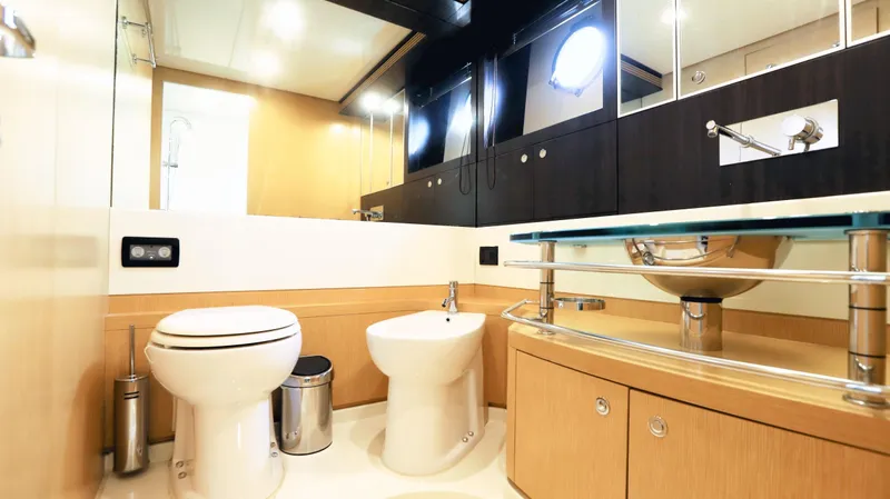 W Yacht Photos Pics Luxurious bathroom interior of 2009 Riva 63 Vertigo yacht, featuring modern fixtures and elegant design.