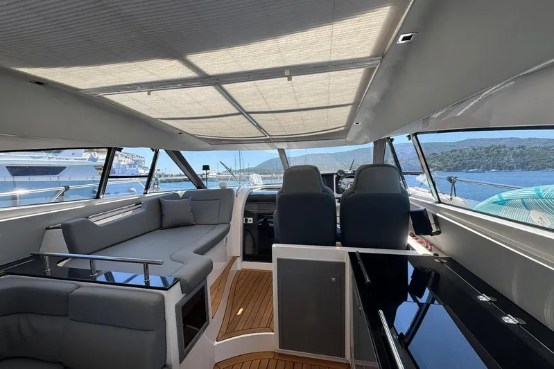  Yacht Photos Pics Interior of 2012 Elan 48 Power yacht with modern seating and scenic ocean view.