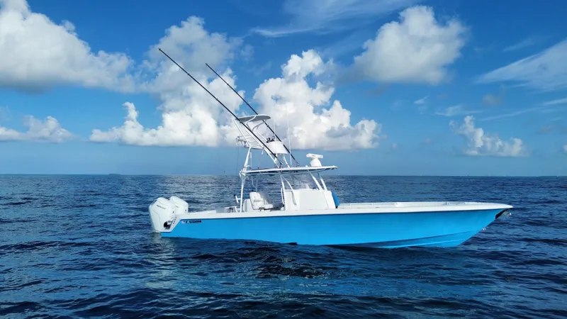  Yacht Photos Pics 2024 Contender 39 ST boat on open ocean under blue sky.
