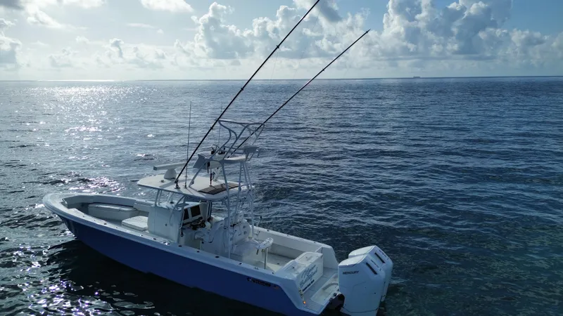  Yacht Photos Pics 2024 Contender 39 ST boat on open ocean under cloudy sky.
