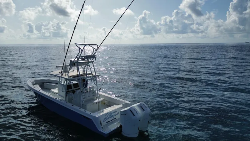  Yacht Photos Pics 2024 Contender 39 ST boat on open ocean under cloudy sky.