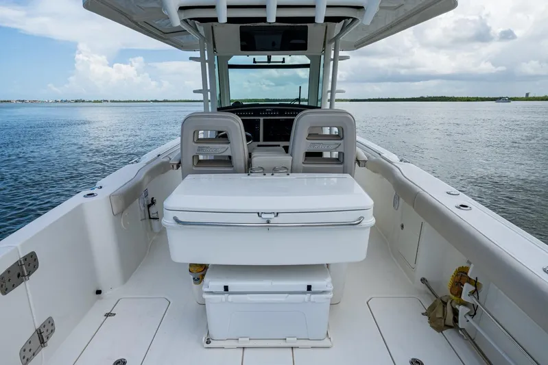 Ducky's Dinghy Yacht Photos Pics 2020 Boston Whaler 330 Outrage boat interior with seating and ocean view.
