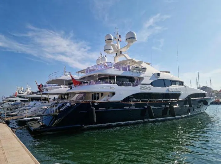  Yacht Photos Pics Luxurious 2010 Benetti Vision 145 yacht docked in a sunny marina.