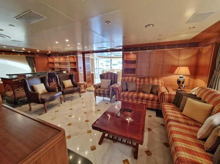  Yacht Photos Pics Luxurious interior of 2010 Benetti Vision 145 yacht with elegant seating and wooden accents.