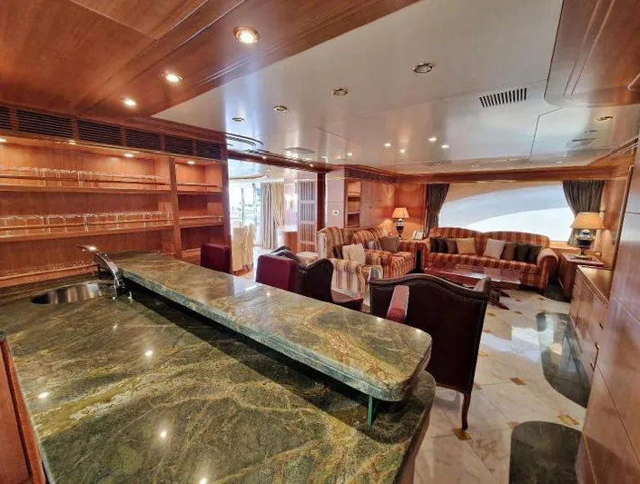  Yacht Photos Pics Luxurious interior of 2010 Benetti Vision 145 yacht with elegant seating and marble bar.