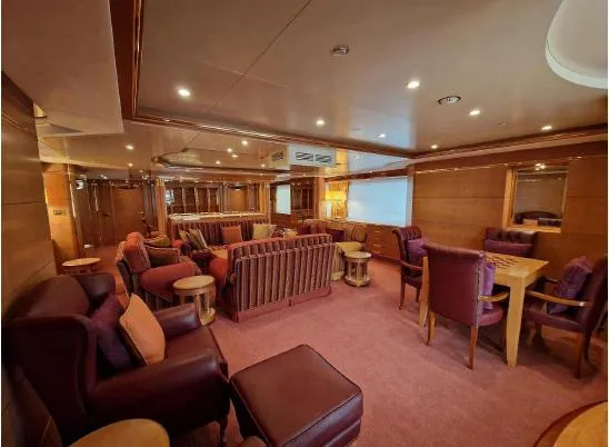  Yacht Photos Pics Luxurious interior of 2010 Benetti Vision 145 yacht with elegant seating and warm lighting.