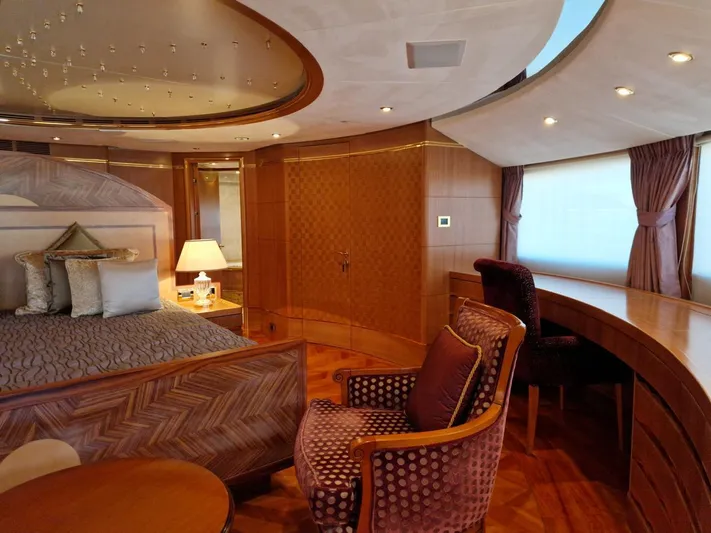  Yacht Photos Pics Luxurious interior of 2010 Benetti Vision 145 yacht, featuring elegant wood finishes and plush furnishings.