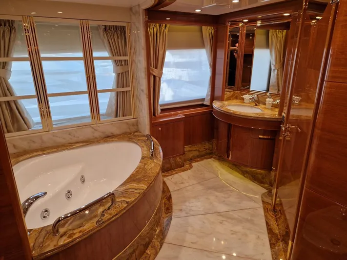  Yacht Photos Pics Luxurious bathroom on 2010 Benetti Vision 145 yacht with marble and wood finishes.