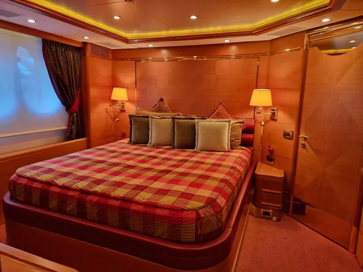  Yacht Photos Pics Luxurious bedroom interior on 2010 Benetti Vision 145 yacht, featuring elegant lighting and plush bedding.