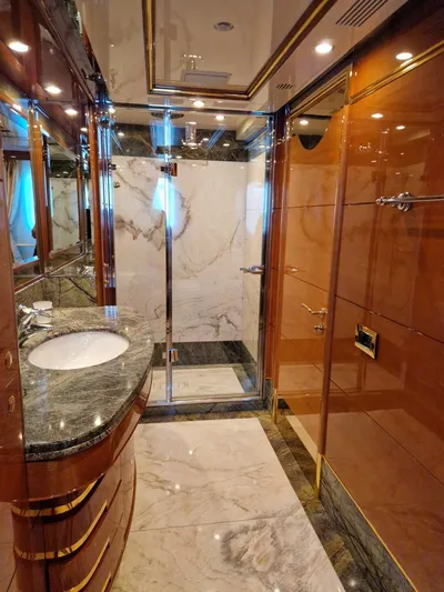  Yacht Photos Pics Luxurious bathroom on a 2010 Benetti Vision 145 yacht, featuring marble and wood finishes.