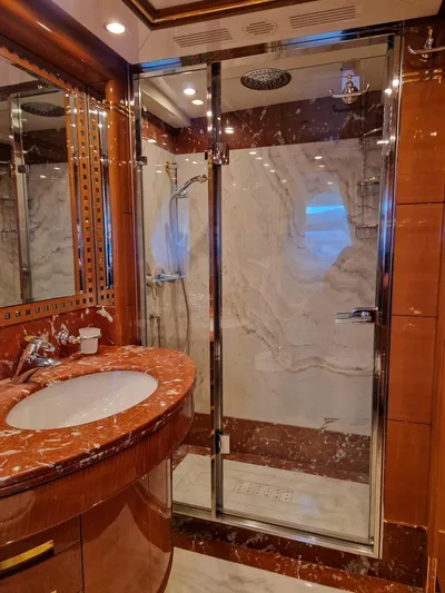  Yacht Photos Pics Luxurious bathroom on 2010 Benetti Vision 145 yacht with marble and glass shower.