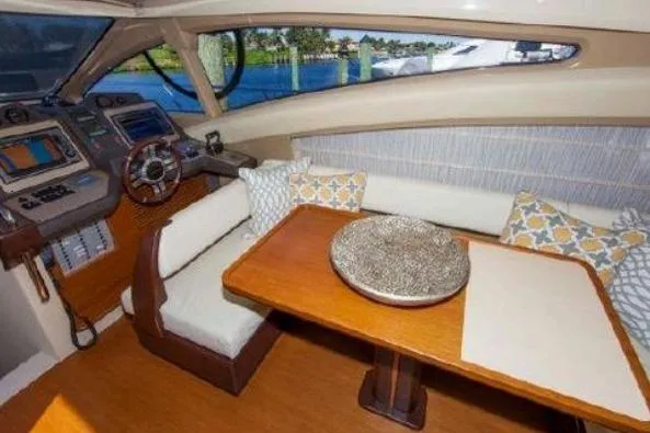 53 Flybridge Yacht Photos Pics Luxurious interior of 2012 Azimut 53 Flybridge yacht with elegant seating and navigation area.