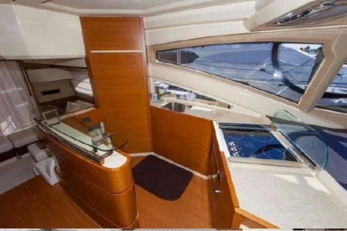 53 Flybridge Yacht Photos Pics Luxurious interior of 2012 Azimut 53 Flybridge yacht with modern design and panoramic windows.