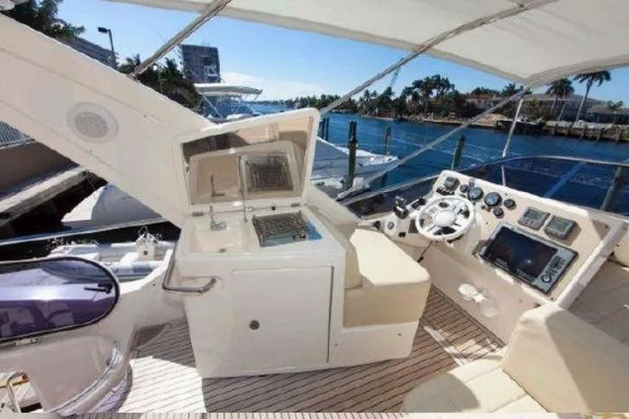 53 Flybridge Yacht Photos Pics Luxurious 2012 Azimut 53 Flybridge yacht interior with modern helm and waterfront view.