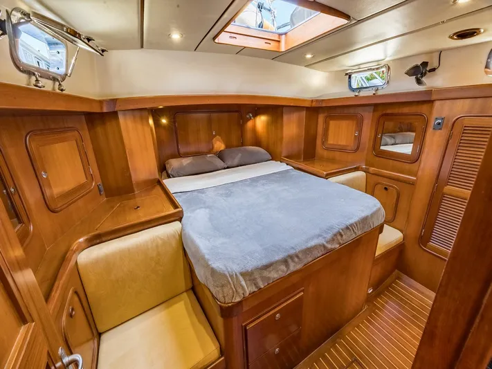 Tutkum Yacht Photos Pics Luxurious 2007 Tayana 48 yacht cabin with wood finish and cozy bed.