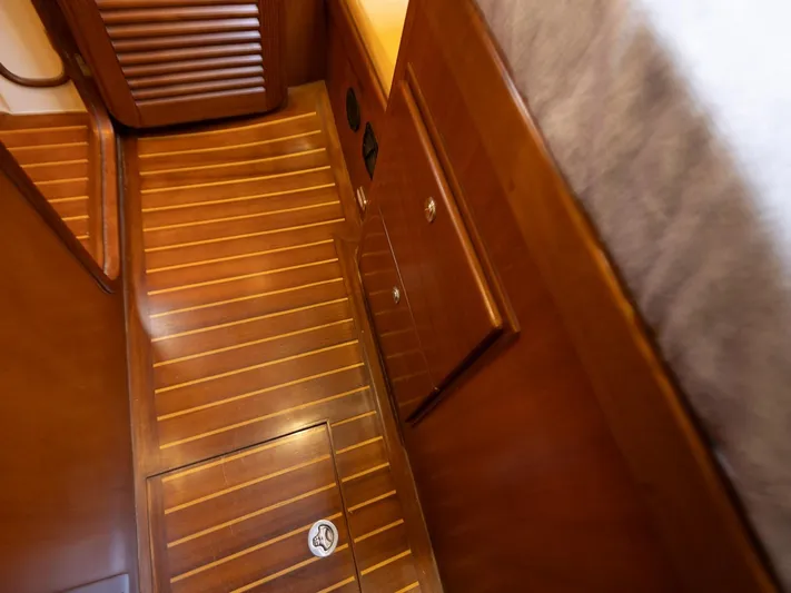 Tutkum Yacht Photos Pics Wooden interior flooring of a 2007 Tayana 48 yacht cabin.