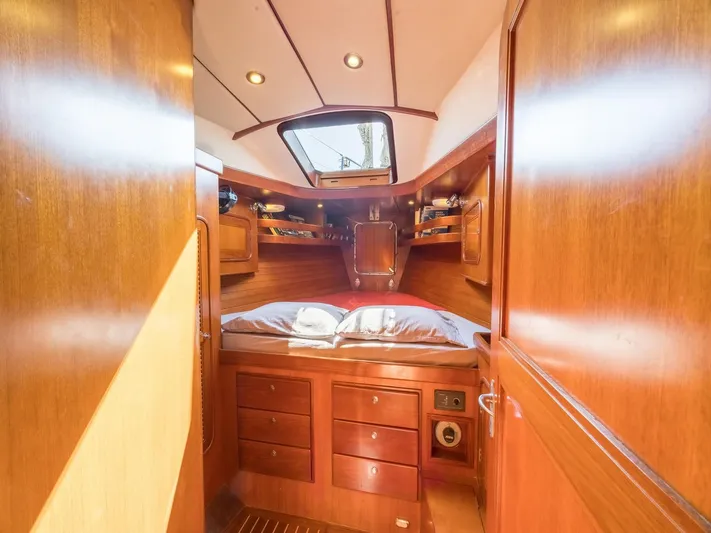 Tutkum Yacht Photos Pics Cozy cabin interior of 2007 Tayana 48 yacht with wooden finish and skylight.