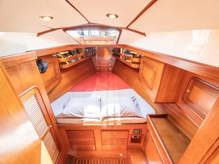 Tutkum Yacht Photos Pics Luxurious 2007 Tayana 48 yacht interior with wooden finish and cozy sleeping area.