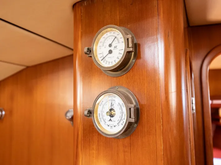 Tutkum Yacht Photos Pics Wooden interior of 2007 Tayana 48 yacht with vintage nautical instruments.